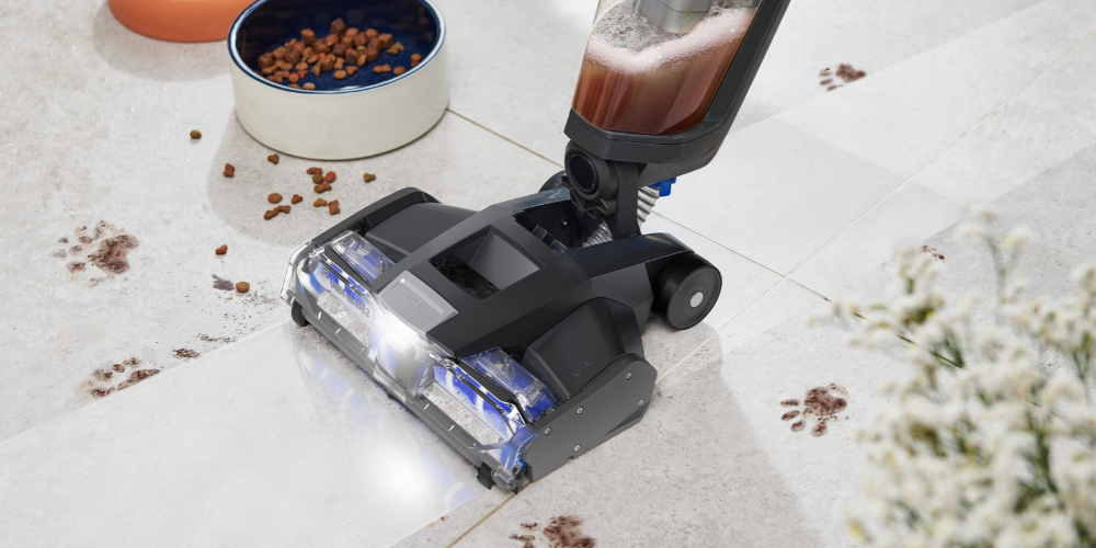 Using a Vax vacuum cleaner to clean mess around pet food bowls