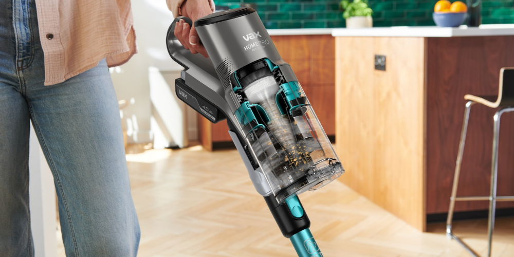 Woman wearing a shirt using a lightweight HomePro vacuum cleaner