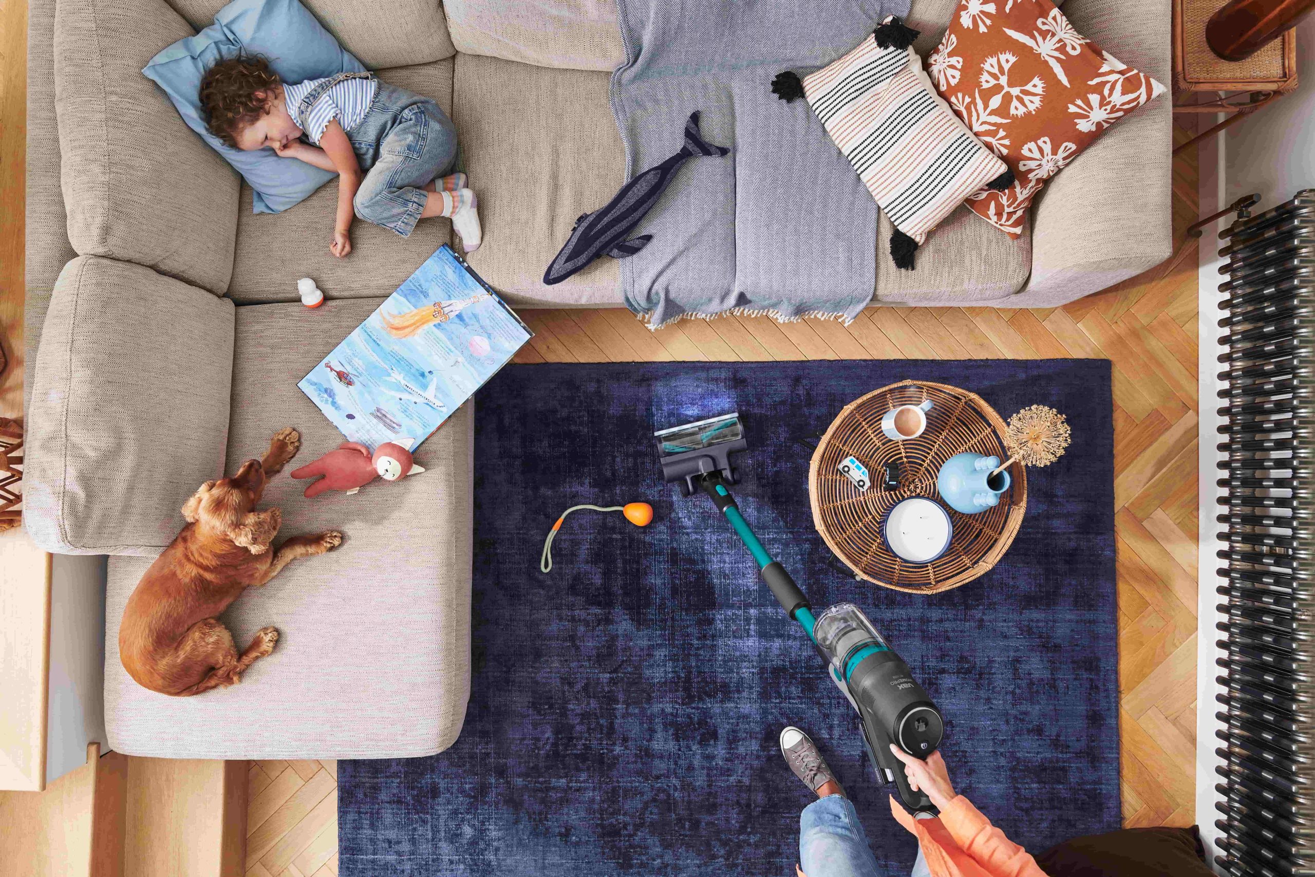 Birds-eye view of a family relaxing and having fun in their lounge