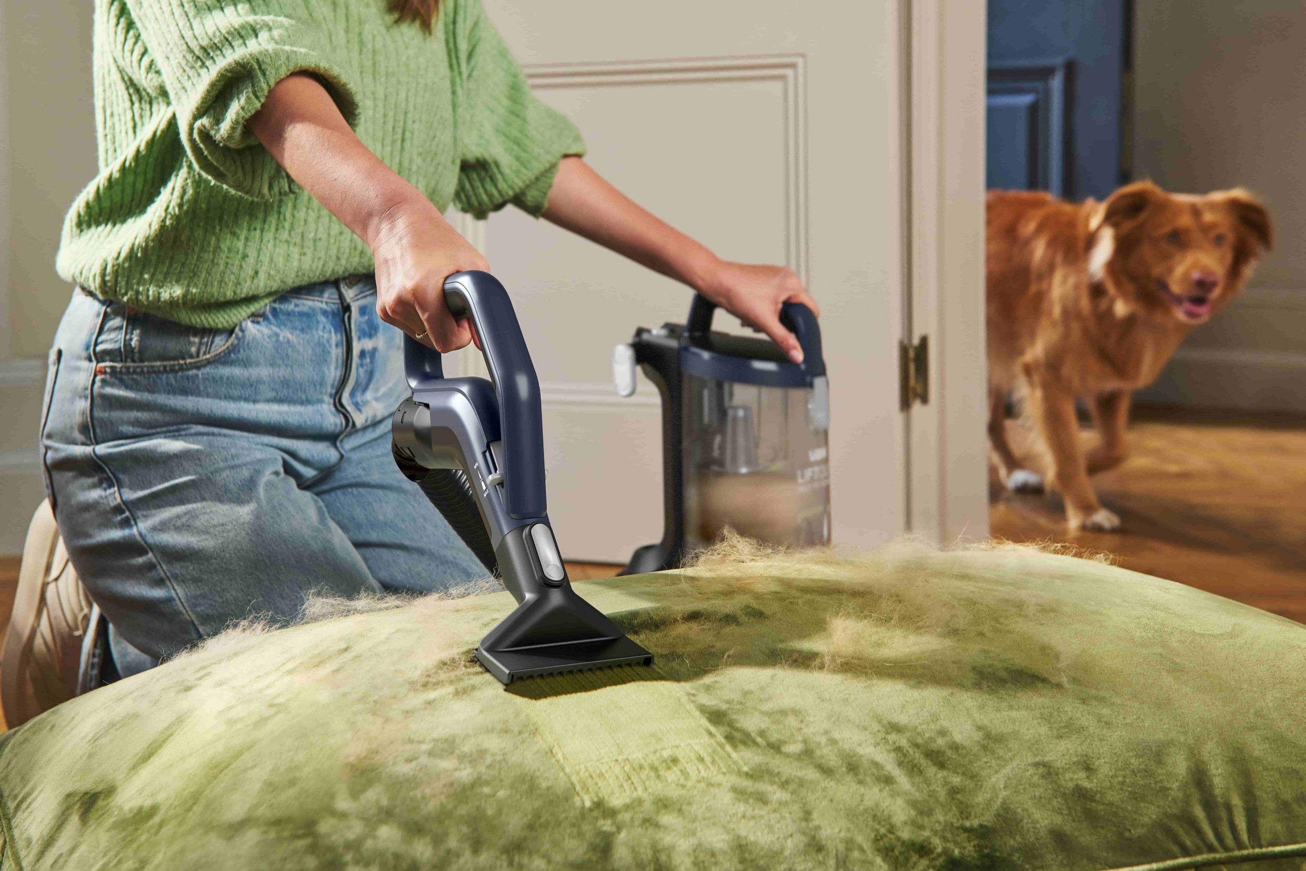 Using a Vax carpet cleaner liftout tool on a bedspread covered with dog hair